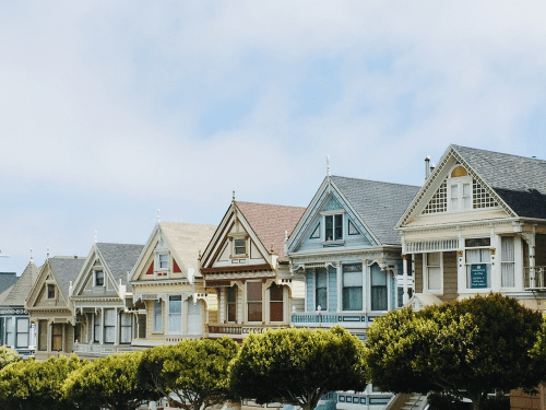 A row of houses on the side of a hill.